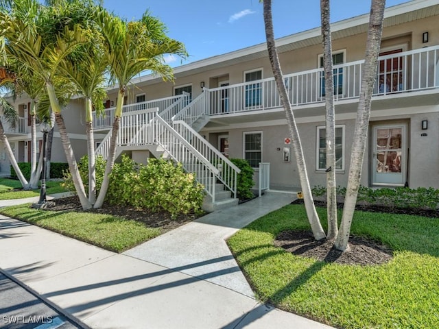 850 Elkhorn Ct Unit 222, Marco Island, FL 34145 - view of property featuring stairway