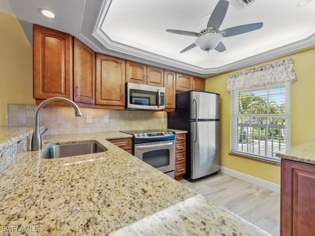 850 Elkhorn Ct Unit 222, Marco Island, FL 34145 - kitchen with appliances with stainless steel finishes, a sink, light stone counters, tasteful backsplash, and recessed lighting
