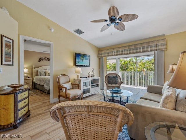 850 Elkhorn Ct Unit 222, Marco Island, FL 34145 - living area featuring lofted ceiling, light wood-style floors, a ceiling fan, and baseboards