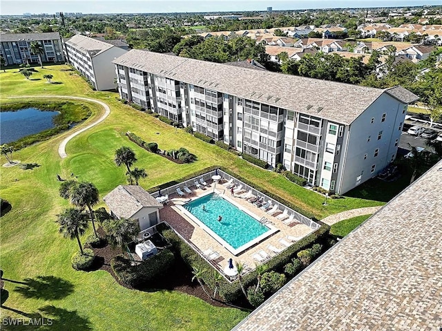 14911 Hole In 1 Cir Unit 310, Fort Myers, FL 33919 - drone / aerial view of apartment complex, a nearby body of water, and a pool