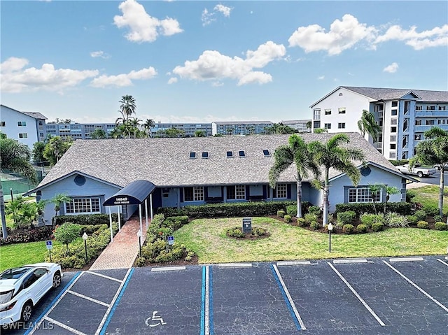 14911 Hole In 1 Cir Unit 310, Fort Myers, FL 33919 - view of property with uncovered parking