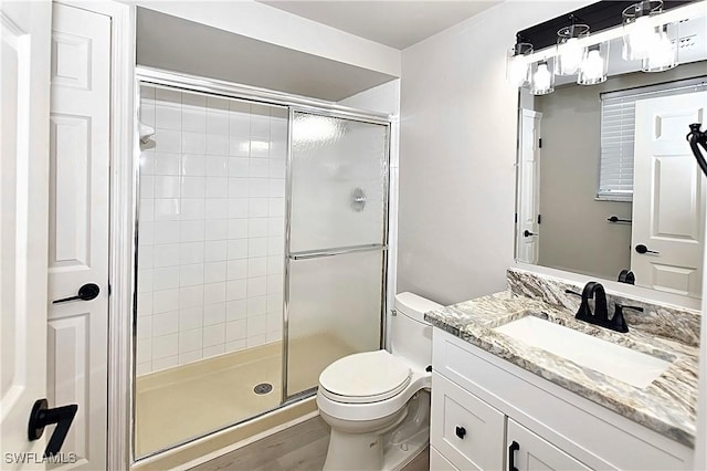 14911 Hole In 1 Cir Unit 310, Fort Myers, FL 33919 - full bathroom with a shower stall, toilet, vanity, and wood finished floors