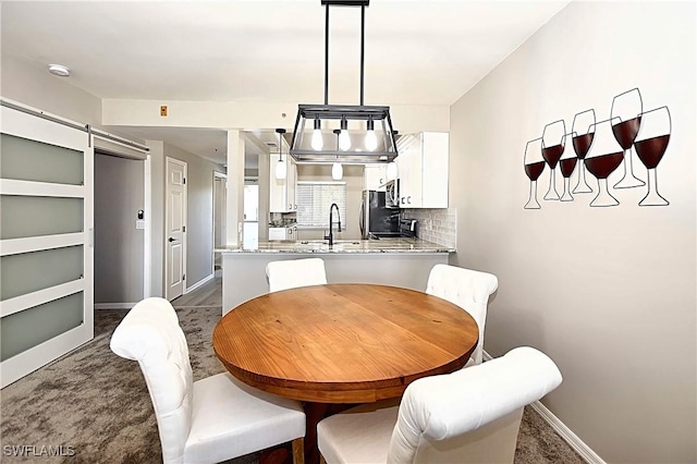 14911 Hole In 1 Cir Unit 310, Fort Myers, FL 33919 - dining space with baseboards and a barn door