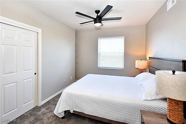 14911 Hole In 1 Cir Unit 310, Fort Myers, FL 33919 - bedroom with dark colored carpet and ceiling fan