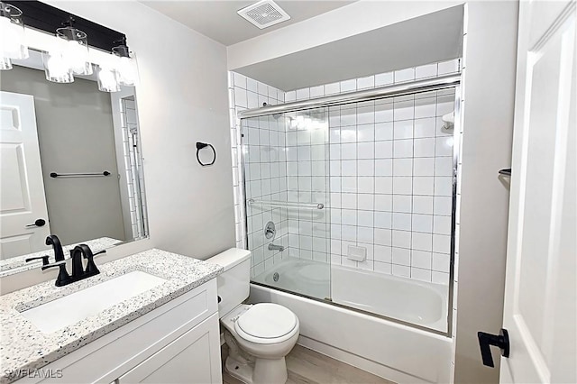 14911 Hole In 1 Cir Unit 310, Fort Myers, FL 33919 - bathroom with toilet, enclosed tub / shower combo, vanity, and a chandelier