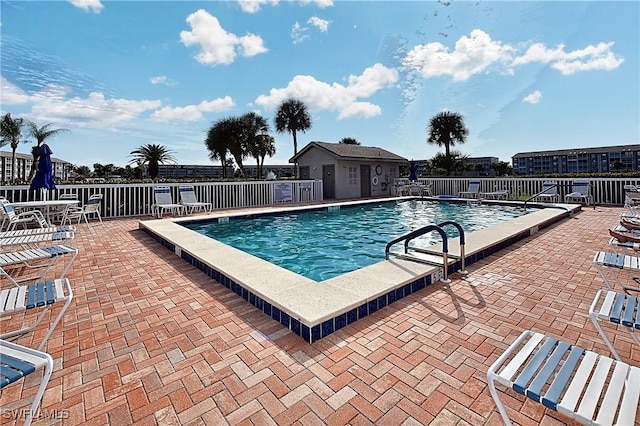 14911 Hole In 1 Cir Unit 310, Fort Myers, FL 33919 - community pool with a patio area and fence