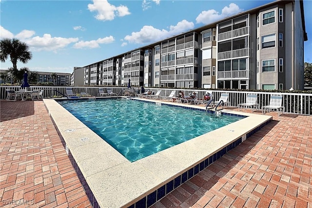 14911 Hole In 1 Cir Unit 310, Fort Myers, FL 33919 - community pool featuring fence and a patio area