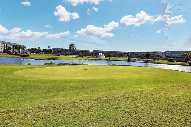 14911 Hole In 1 Cir Unit 310, Fort Myers, FL 33919 - view of community featuring view of golf course, a water view, and a yard