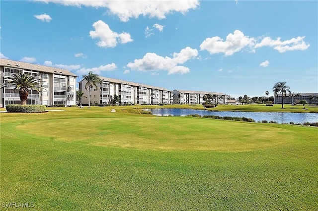 14911 Hole In 1 Cir Unit 310, Fort Myers, FL 33919 - view of home's community featuring a water view, view of golf course, and a lawn