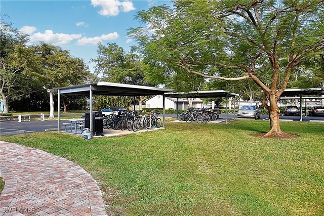 14911 Hole In 1 Cir Unit 310, Fort Myers, FL 33919 - view of property's community featuring a lawn