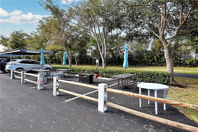14911 Hole In 1 Cir Unit 310, Fort Myers, FL 33919 - view of home's community featuring view of wooded area