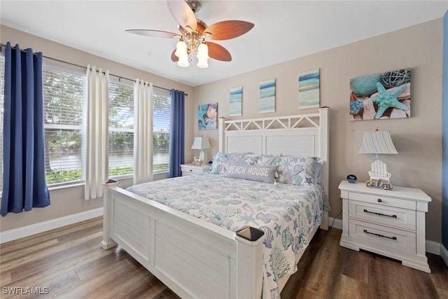 10115 Colonial Country Club Blvd Unit 2110, Fort Myers, FL 33913 - bedroom featuring baseboards, multiple windows, and dark wood finished floors