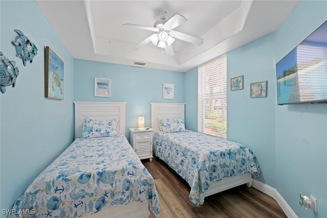 10115 Colonial Country Club Blvd Unit 2110, Fort Myers, FL 33913 - bedroom featuring a raised ceiling, wood finished floors, a ceiling fan, and baseboards