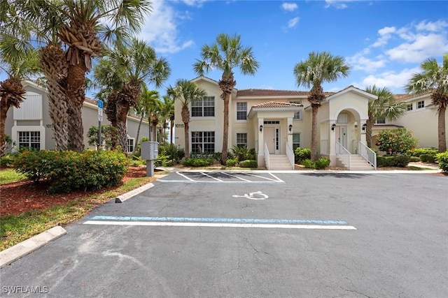 10115 Colonial Country Club Blvd Unit 2110, Fort Myers, FL 33913 - view of front facade featuring uncovered parking and stucco siding