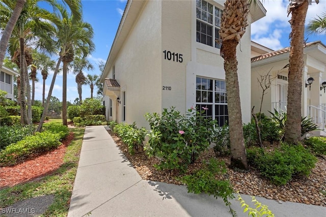 10115 Colonial Country Club Blvd Unit 2110, Fort Myers, FL 33913 - view of exterior entry with stucco siding