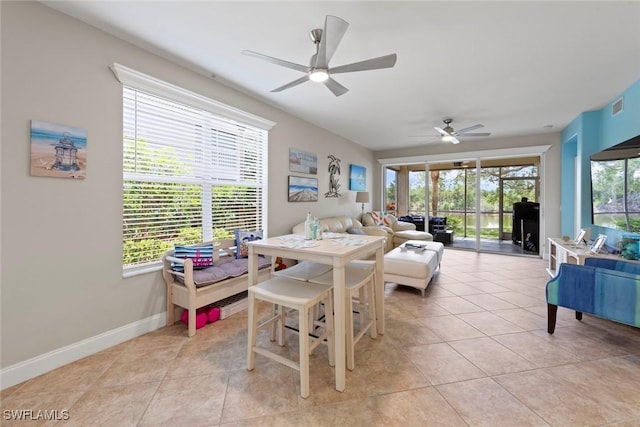10115 Colonial Country Club Blvd Unit 2110, Fort Myers, FL 33913 - living room featuring a ceiling fan, light tile patterned floors, and baseboards
