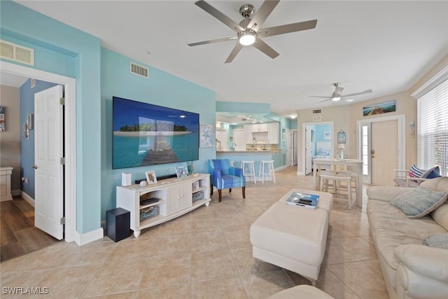 10115 Colonial Country Club Blvd Unit 2110, Fort Myers, FL 33913 - living room featuring a ceiling fan, light tile patterned flooring, and baseboards