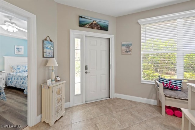 10115 Colonial Country Club Blvd Unit 2110, Fort Myers, FL 33913 - entrance foyer featuring ceiling fan, baseboards, and light tile patterned floors