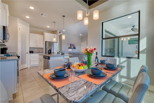 dining room featuring light tile patterned flooring, ceiling fan, recessed lighting, and baseboards