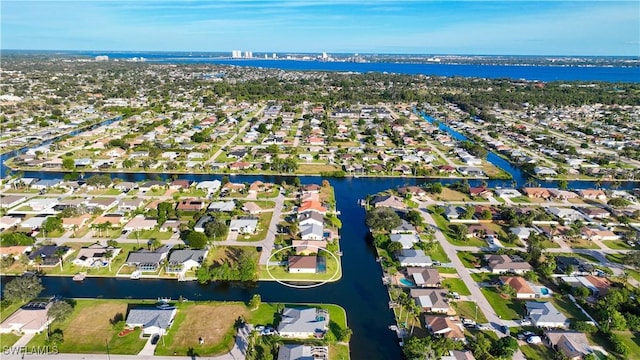 aerial perspective of suburban area featuring a large body of water
