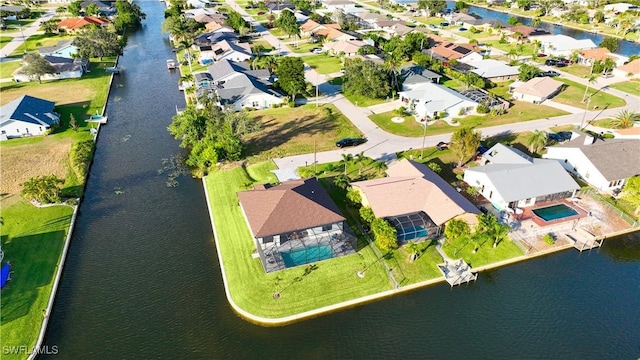 aerial perspective of suburban area with a large body of water