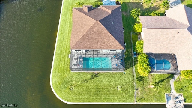 aerial view of property and surrounding area featuring a pool
