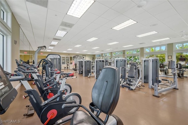 exercise room featuring a paneled ceiling