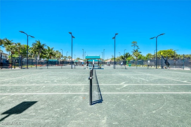 view of tennis court with fence
