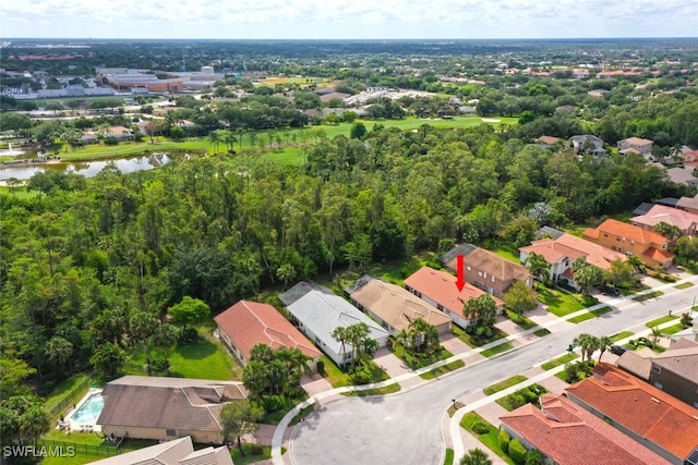 aerial view of residential area with a large body of water