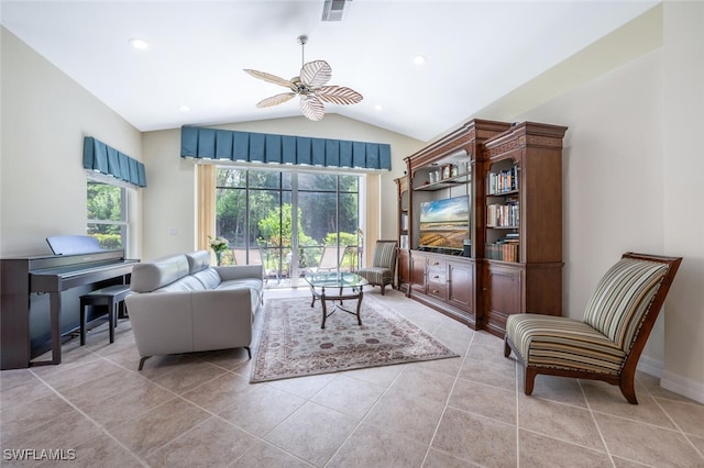 living area featuring vaulted ceiling, a ceiling fan, and light tile patterned floors