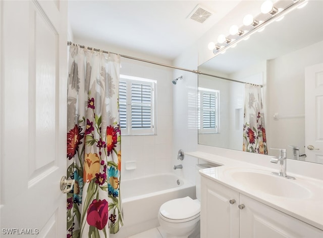 full bath with toilet, vanity, and shower / bath combo with shower curtain