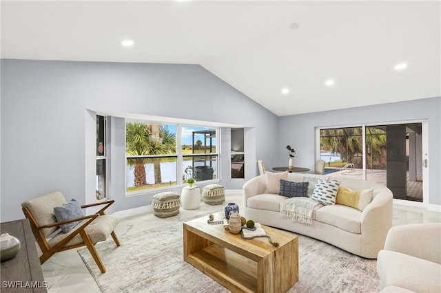 12721 Kelly Sands Way, Fort Myers, FL 33908 - living room featuring marble look tile flooring, lofted ceiling, recessed lighting, and a water view