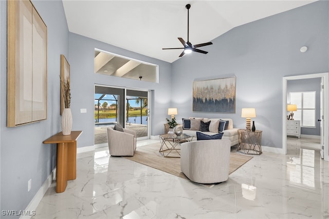 12721 Kelly Sands Way, Fort Myers, FL 33908 - living area featuring marble tiled floors, baseboards, ceiling fan, a water view, and high vaulted ceiling