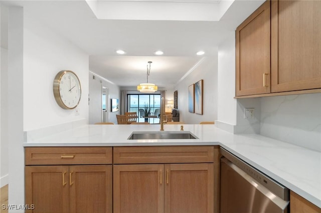 kitchen with a sink, dishwasher, a peninsula, recessed lighting, and hanging light fixtures