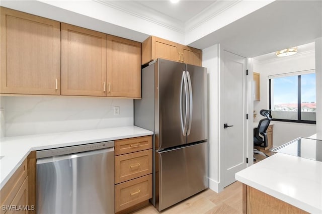 kitchen featuring stainless steel appliances, ornamental molding, light countertops, light wood-style flooring, and decorative backsplash