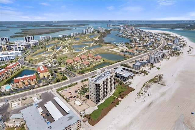 view of urban area with a large body of water and apartment complex