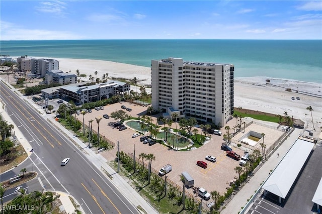 drone / aerial view of apartment complex / building and expansive beach