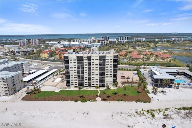 aerial view of a nearby body of water and apartment complex / building