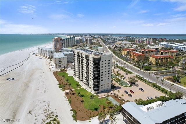 view of urban area with expansive beach and apartment complex
