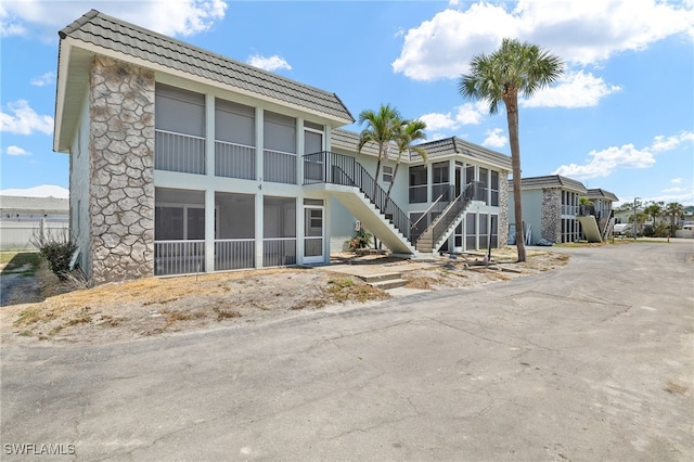 view of property featuring stairway