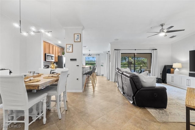 9510 Avellino Way Unit 1924, Naples, FL 34113 - living area featuring ornamental molding, a ceiling fan, and light tile patterned floors