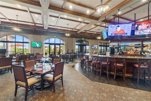9510 Avellino Way Unit 1924, Naples, FL 34113 - dining area with coffered ceiling, a dry bar, and beamed ceiling