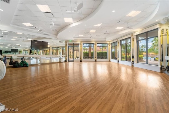 9510 Avellino Way Unit 1924, Naples, FL 34113 - workout room with a drop ceiling and wood finished floors