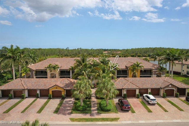 9510 Avellino Way Unit 1924, Naples, FL 34113 - mediterranean / spanish-style home featuring a tile roof and community garages
