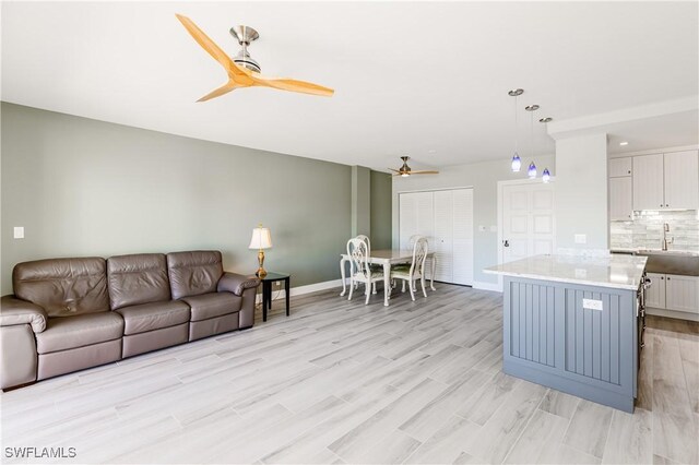 500 Saturn Ct Unit 48, Marco Island, FL 34145 - living room with ceiling fan, light wood-style floors, baseboards, and recessed lighting