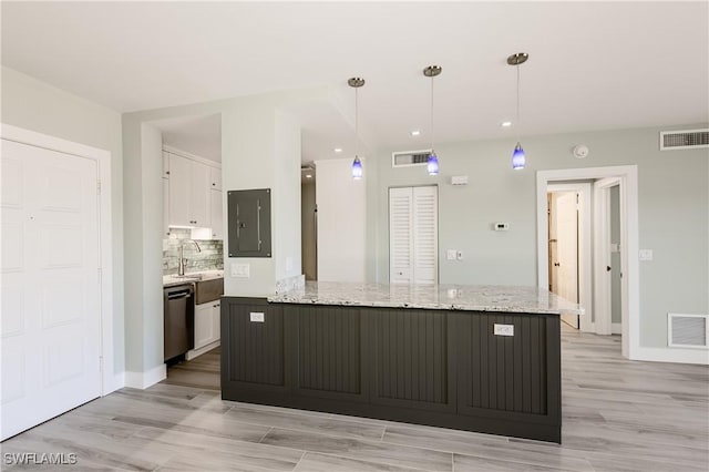 500 Saturn Ct Unit 48, Marco Island, FL 34145 - kitchen featuring white cabinets, dishwasher, light wood finished floors, tasteful backsplash, and decorative light fixtures