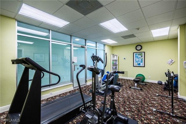 500 Saturn Ct Unit 48, Marco Island, FL 34145 - exercise room featuring a paneled ceiling and baseboards