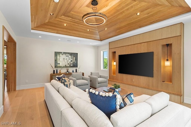 living area featuring a raised ceiling, light wood-style floors, wooden ceiling, recessed lighting, and baseboards