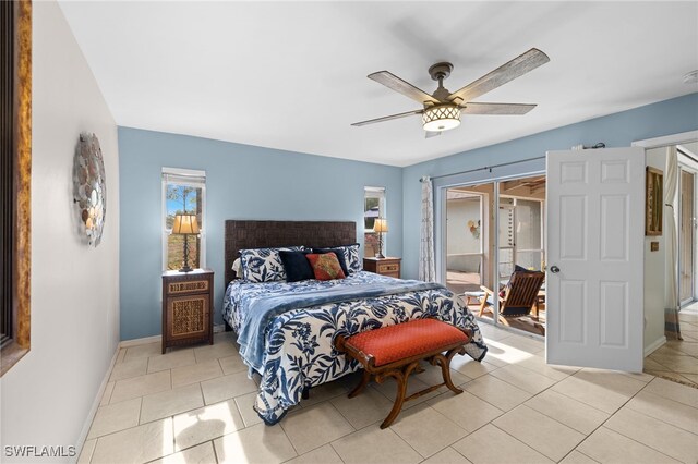 bedroom featuring baseboards, light tile patterned floors, and ceiling fan