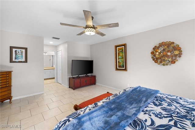 bedroom featuring baseboards, light tile patterned flooring, ensuite bath, ceiling fan, and recessed lighting